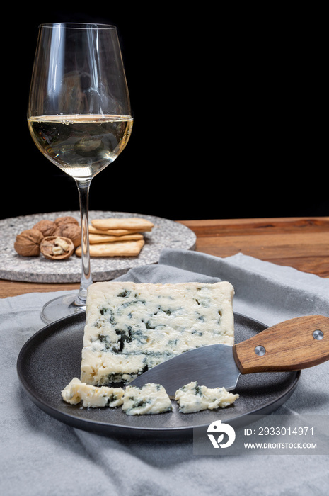 Cheese and wine pairing, french soft blue roquefort cheese and sweet white sauternes wine from Bordeaux, France