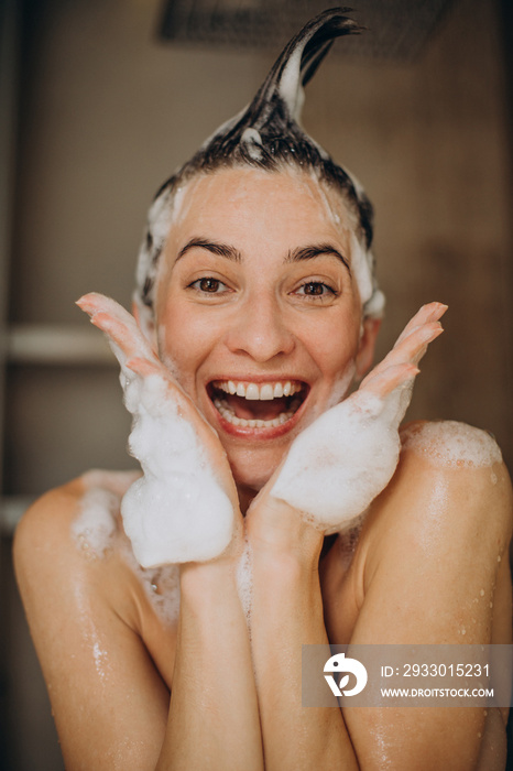 Young woman taking shower at home