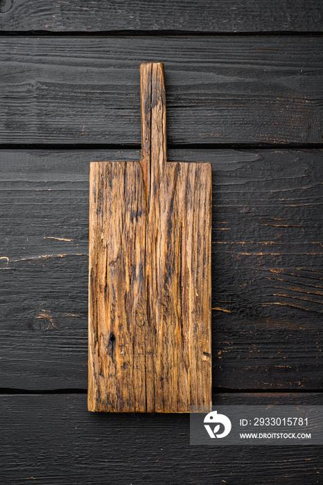 Old cutting board, top view flat lay , with copy space for text or food, on black wooden table background