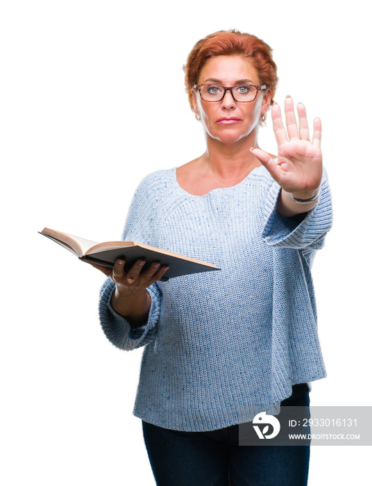 Senior caucasian woman reading a book over isolated background with open hand doing stop sign with serious and confident expression, defense gesture