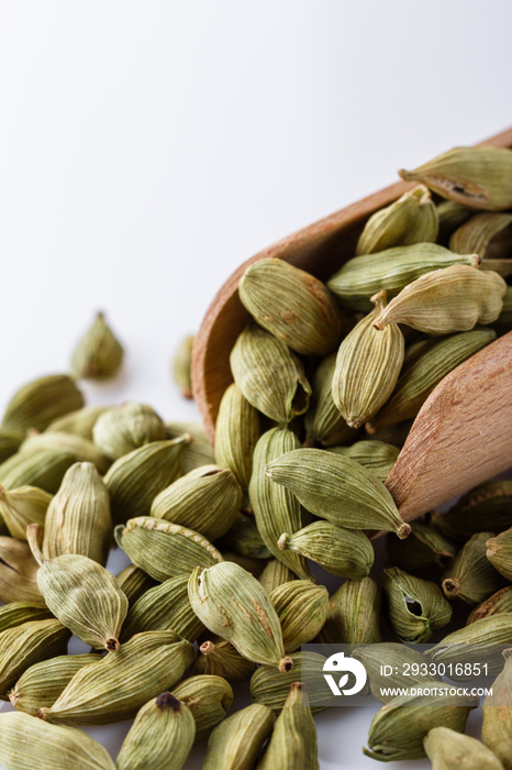 fragrant green cardamom on a white acrylic background