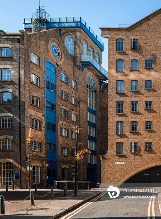 The east-northern end of Mill Street, near Tower Bridge, in London, England. These old warehouses are now converted to modern apartments.