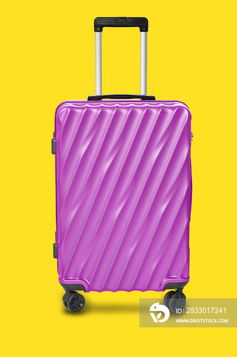 Modern purple suitcases bag isolated on yellow background with clipping path on luggage object