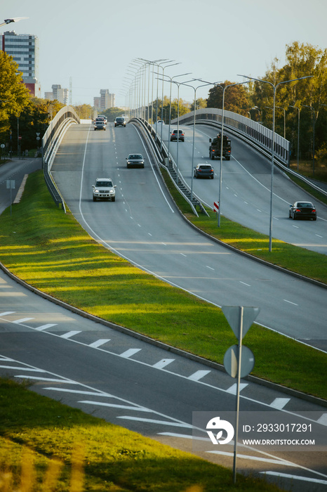 Highway road with cars during sunset time