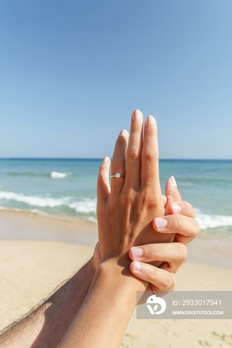 Young Happy Couple Is Getting Engaged In Wedding Proposal On Exotic Beach