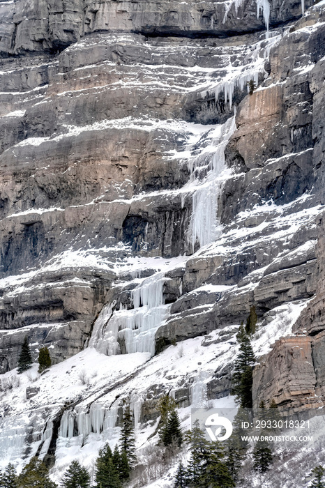 Bridal Veil Falls with frozen water on steep slope during winter in Provo Canyon