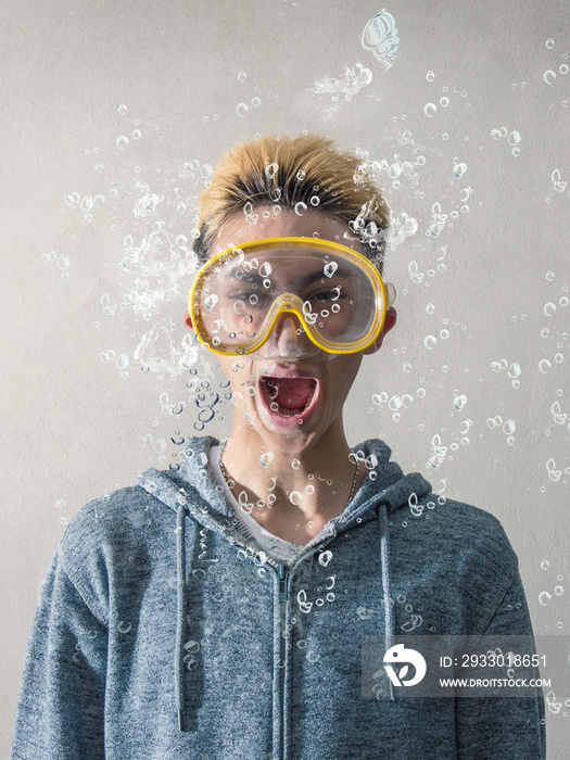 woman having a scuba mask under water