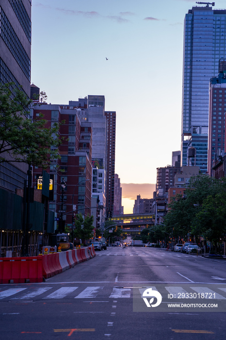 New York crowds and traffic at night. Empty road goes through Manhattan island near Time Square.