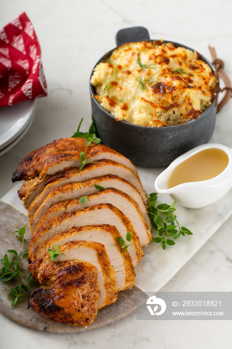 Roasted turkey breast sliced on a plate for holidays