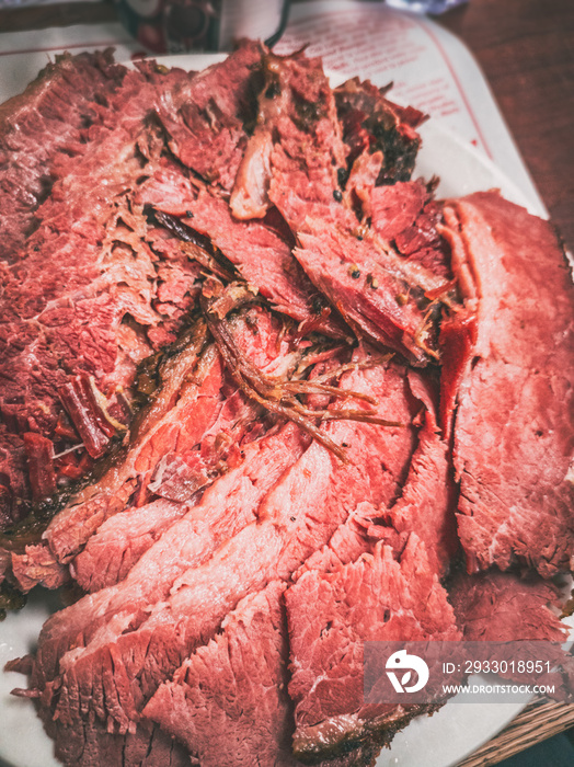 Smoked meat plate at local food deli restaurant. Closeup of sliced beef meal eat. Mobile picture taken with phone.