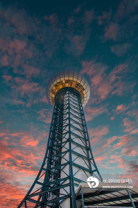 a gorgeous view of the gold and green Sunsphere with powerful clouds at sunset in Knoxville Tennessee USA