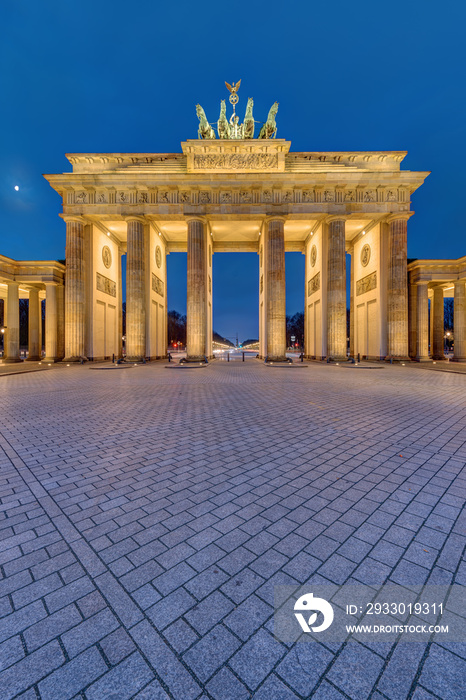 The famous illuminated Brandenburg Gate in Berlin early in the morning
