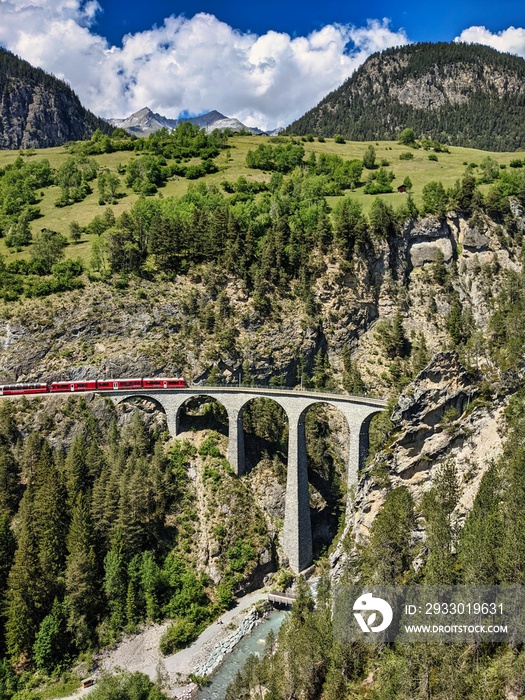 Railway bridge in Switzerland. Landwasser Viaduct in Graubunden near Davos Klosters Filisur. Railway company emblem.