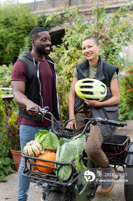 Portrait of smiling couple in vegetable garden