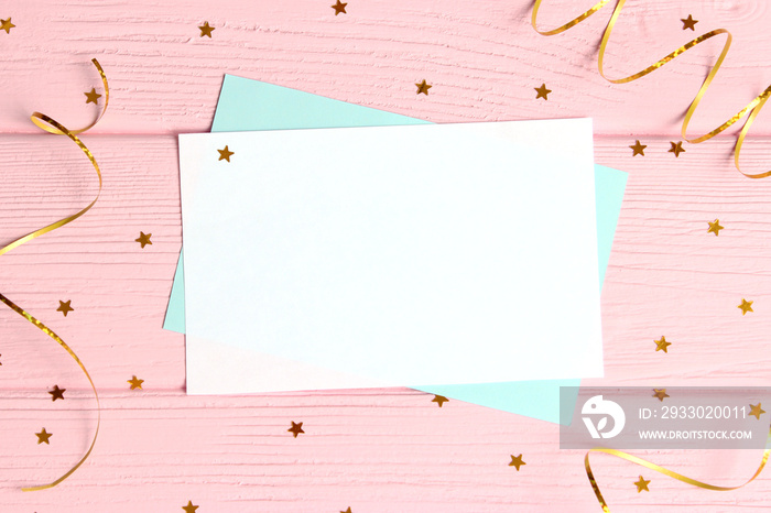 sparkles confetti and card for inserting text on a colored background top view. Minimalism, design, insta, holiday. flatlay