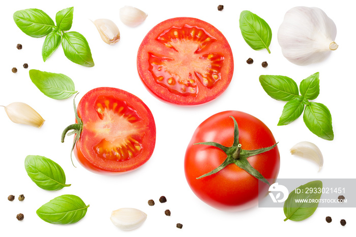 fresh tomato slices with garlic and basil leaves isolated on white background. top view