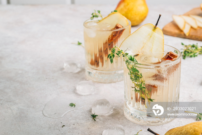 Festive summer spicy cocktail with pears and thyme on light beige background.