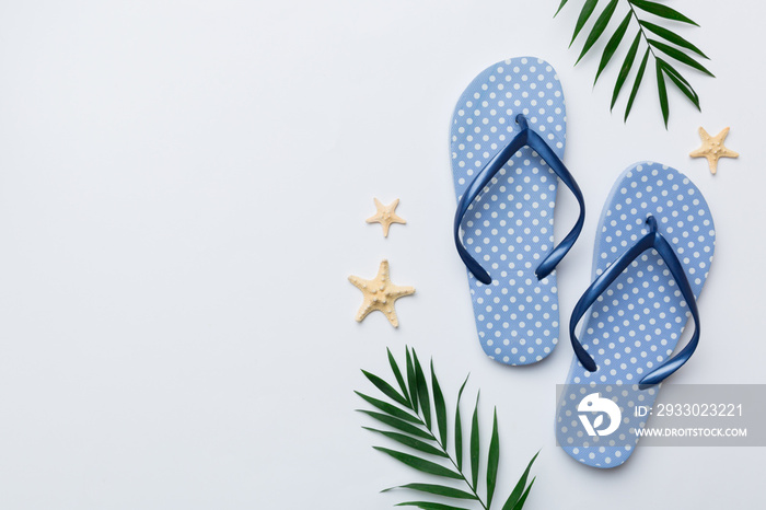 Flat lay composition with flip flops and seashell on colored background. Space for text top view