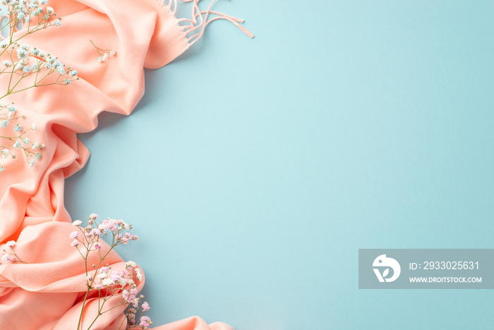 Hello spring concept. Top view photo of gypsophila flowers and pink soft scarf on isolated pastel blue background with empty space