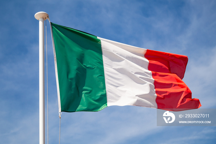 Flag of Italy waving on wind over sky