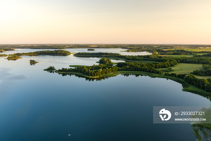 Aerial view of scenic Rubikiai lake, located near Anyksciai town, Lithuania. Landscape view from the above on summer sunset.