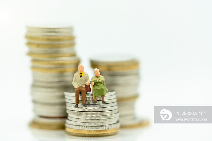 Miniature people: Happy old people standing on coins stack, Retirement planning, Emergency plan, Life insurance and Financial Concept.