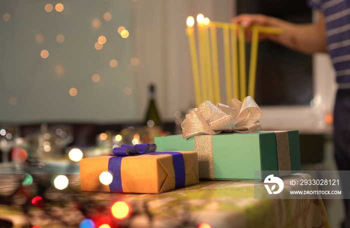 Lighting the eight candles in the menorah.  Chanukah is the Jewish eight-day, wintertime “festival of lights,” celebrated with a nightly menorah lighting, special prayers and fried foods