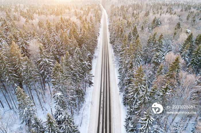 Aerial view of road in winter forest