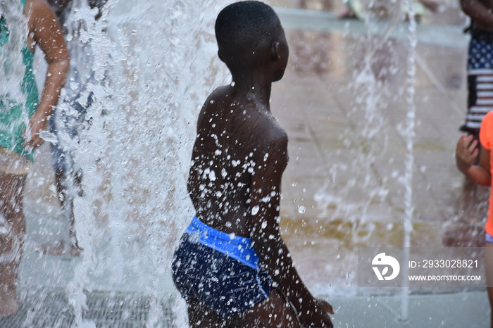 Boy enjoying water fountain in Atlanta