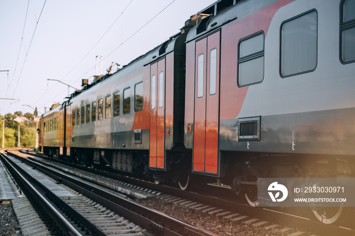 Passenger electric train moving on the railway.