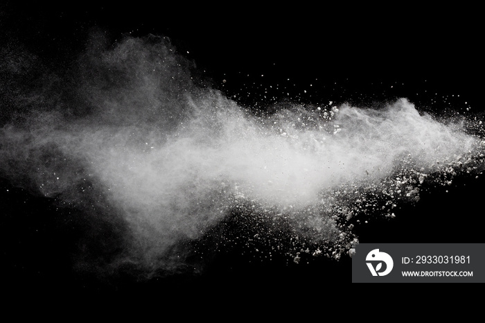 Abstract white powder explosion.White dust debris on black background.