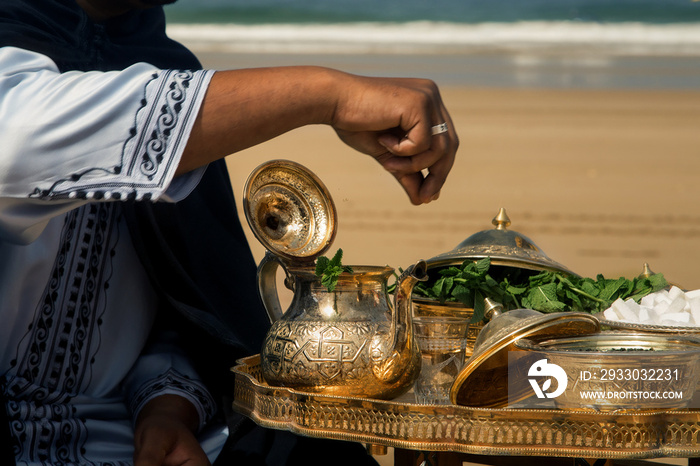 wedding ceremony on the ocean in Morocco, traditional Moroccan tea with mint