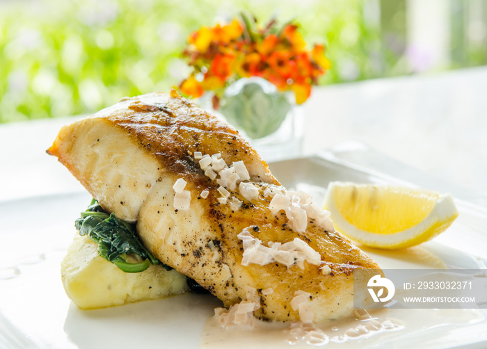 Fish Black Cod Steak Premium Ingredients with mash potato and spinach very healthy food. International food.