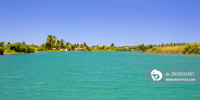 Tropical nature and Turquois waters of  Manakara river and canal des pangalanes mixing with the ocean, Madagascar, African rivers