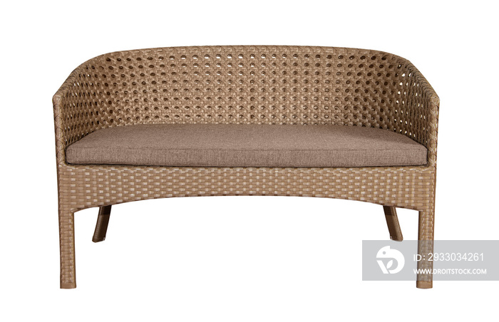 Sofa made of wicker rattan with a soft pillow. Furniture for the garden or terrace.