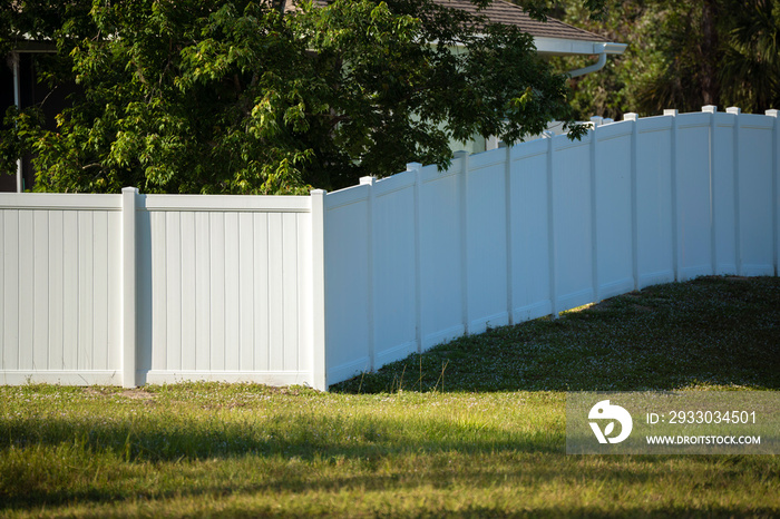 White plastic fence for back yard protection and privacy