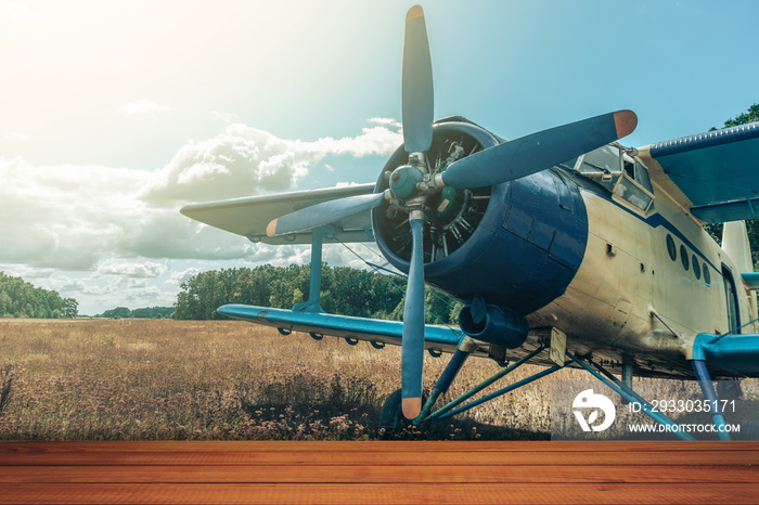 Red wooden table and beautiful airplane background.