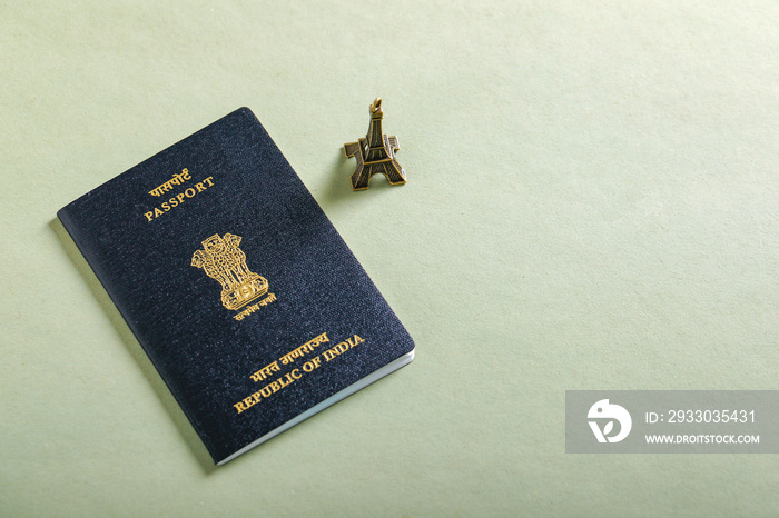 travel concept , Indian passport with Eiffel tower miniature