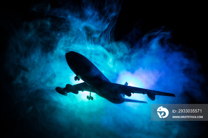 Artwork decoration. White passenger plane ready to taking off from airport runway. Silhouette of Aircraft during night time.