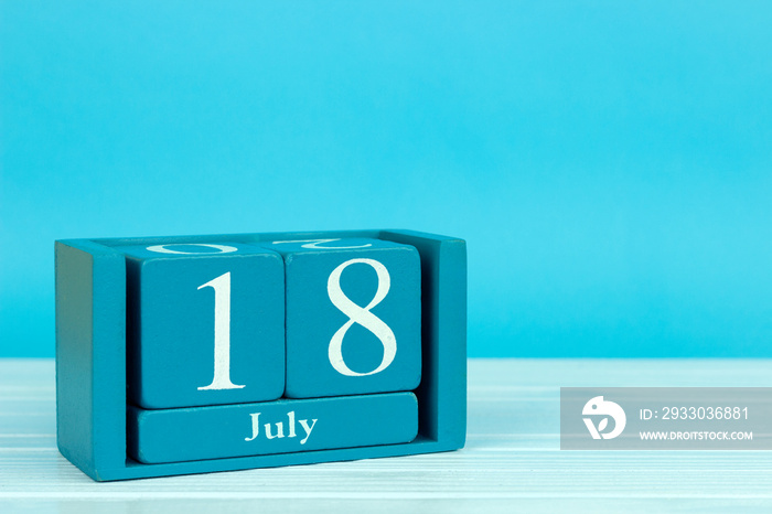 wooden calendar with the date of july 18 on a blue wooden background, International Nelson Mandela Day