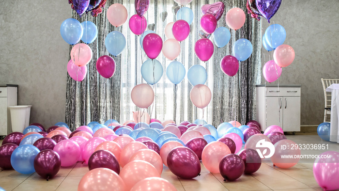 party decoration with pink and blue baloons in a restaurant