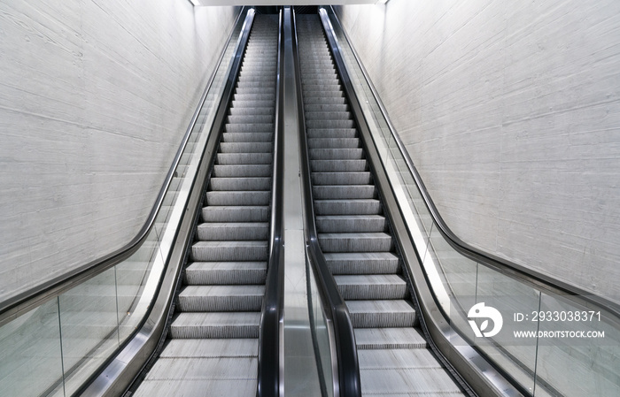 empty long escalator in a train station