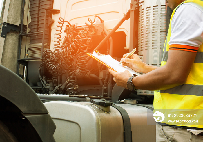 Truck Driver is Checking the Semi Truck’s Engine Maintenance Checklist. Lorry Driver. Inspection Truck Safety Driving. Shipping Cargo Freight Truck Transport.