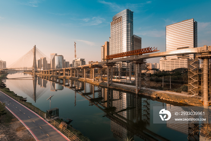 View of Pinheiros River With Modern Buildings Alongside and Famous Octavio Frias de Oliveira Bridge in Sao Paulo City