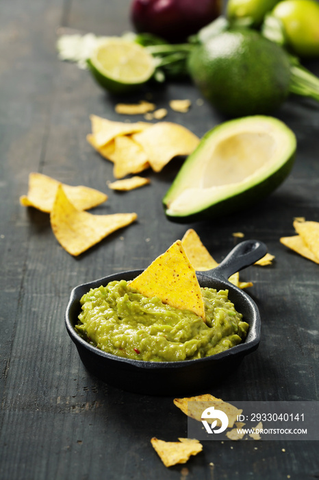 Mexican nachos chips with homemade fresh guacomole sauce