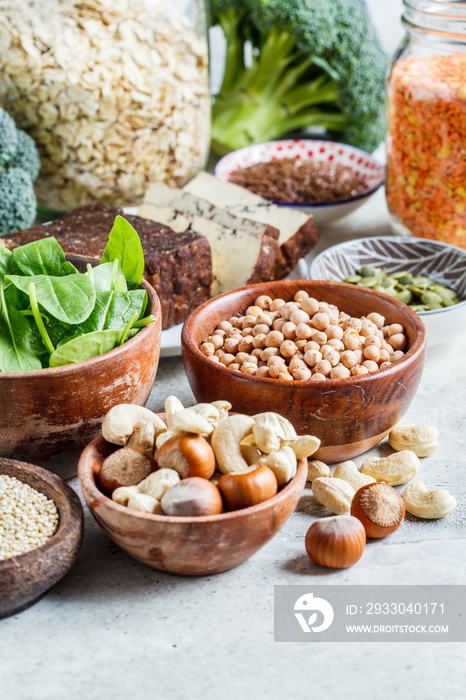 Vegan sources of protein. Tofu, chickpeas, lentils, nuts, spinach and broccoli - vegetable proteins.