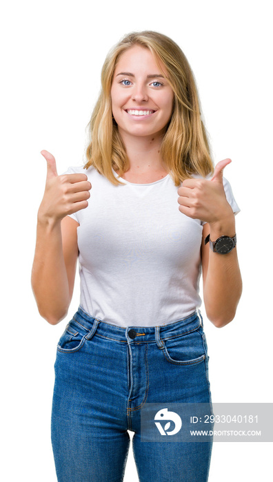 Beautiful young woman wearing casual white t-shirt over isolated background success sign doing positive gesture with hand, thumbs up smiling and happy. Looking at the camera with cheerful expression