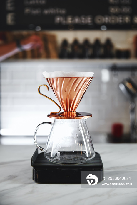 The V60 hario coffee dripper, devices for coffee in the background, close up