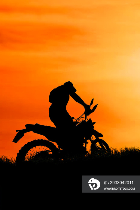 motocross driver silhouette in the evening