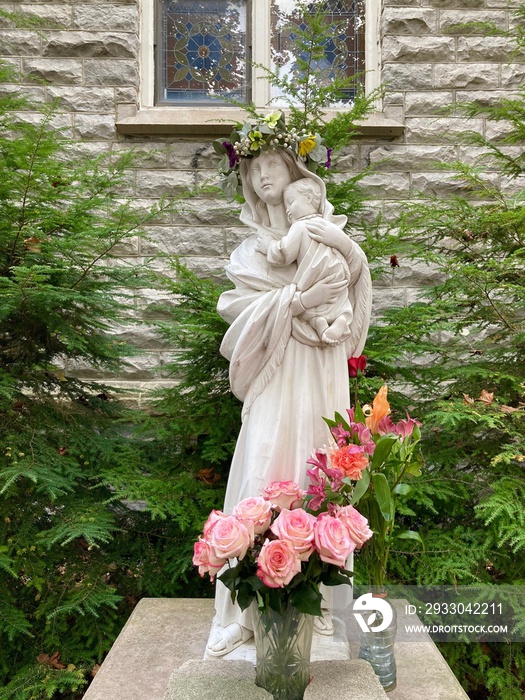 statue of Mary and baby Jesus in garden